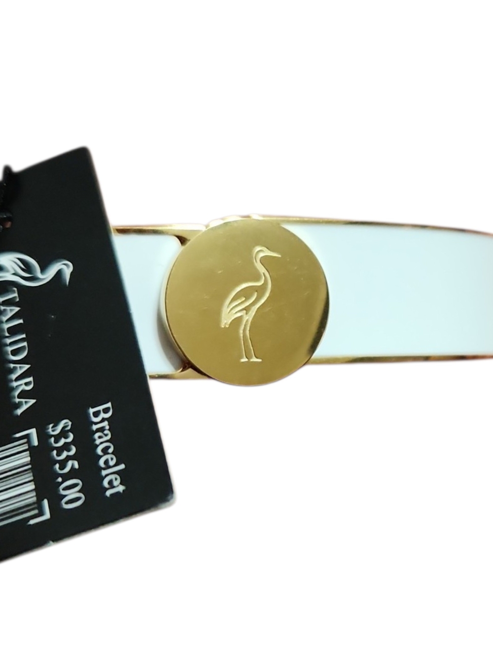 Talidara white enamel cuff bracelet accented with a polished gold-tone
